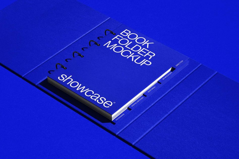 Blue ring-bound book folder mockup in perspective view on a blue background, perfect for presentations, digital portfolio design assets.